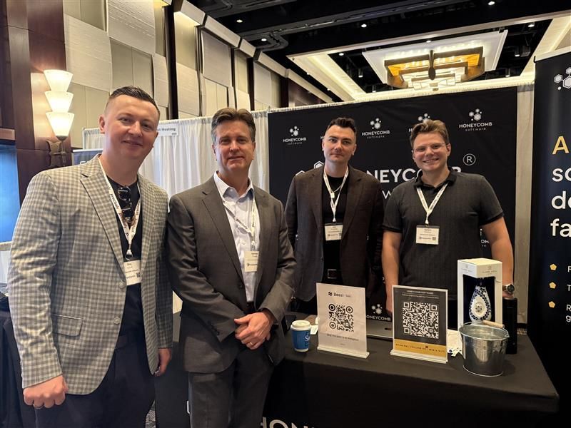 Honeycomb Software team members at the company booth