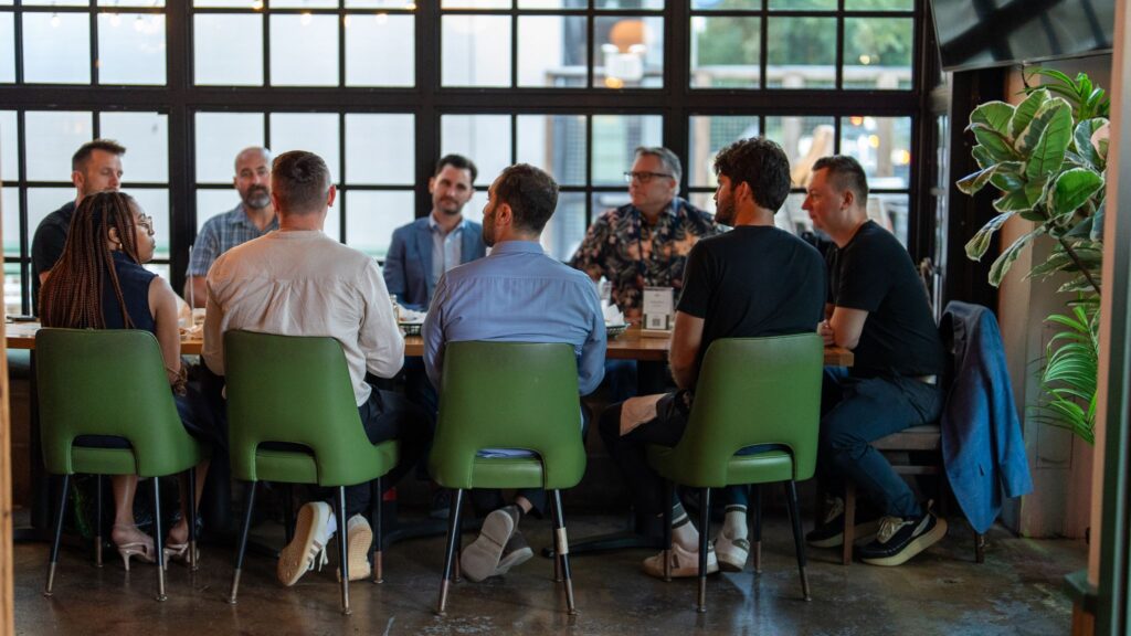 Group of participants seated around a table during an evening CTO Talks discussion
