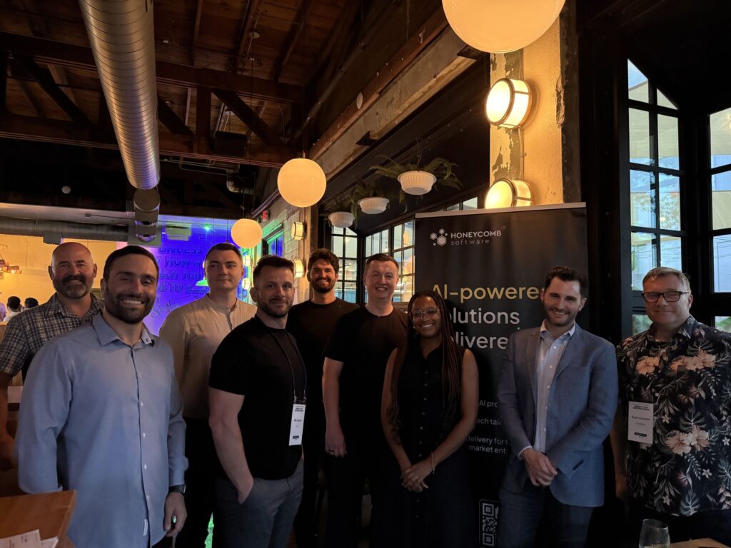 Group of attendees standing together at an evening CTO Talks event